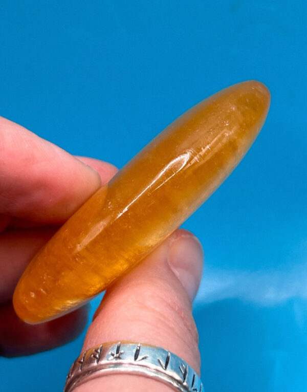 Orange Calcite Palm Stone - Image 4